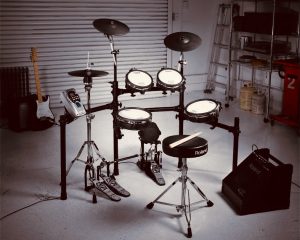 The Roland TD-15KV set up in a garage as part of a photoshoot/demo